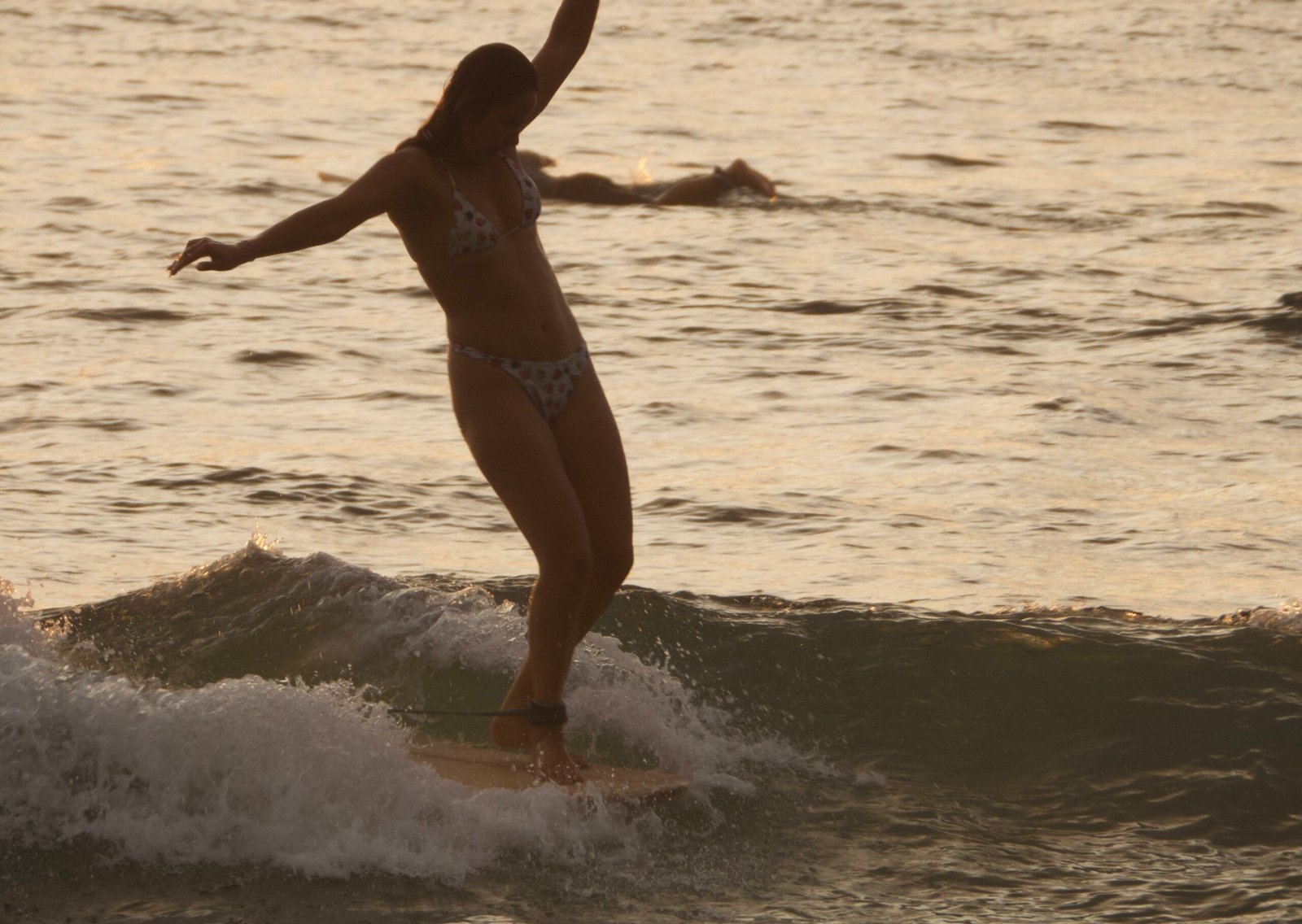Women's longboard progression surf coaching at Fuga